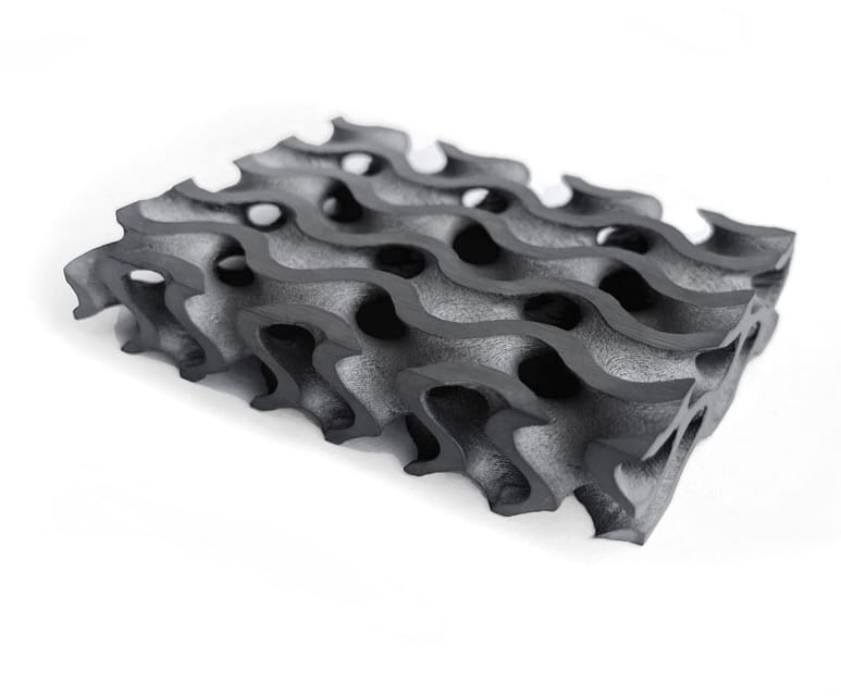 Dark sintered silicon carbide gyroid with curved internal surfaces