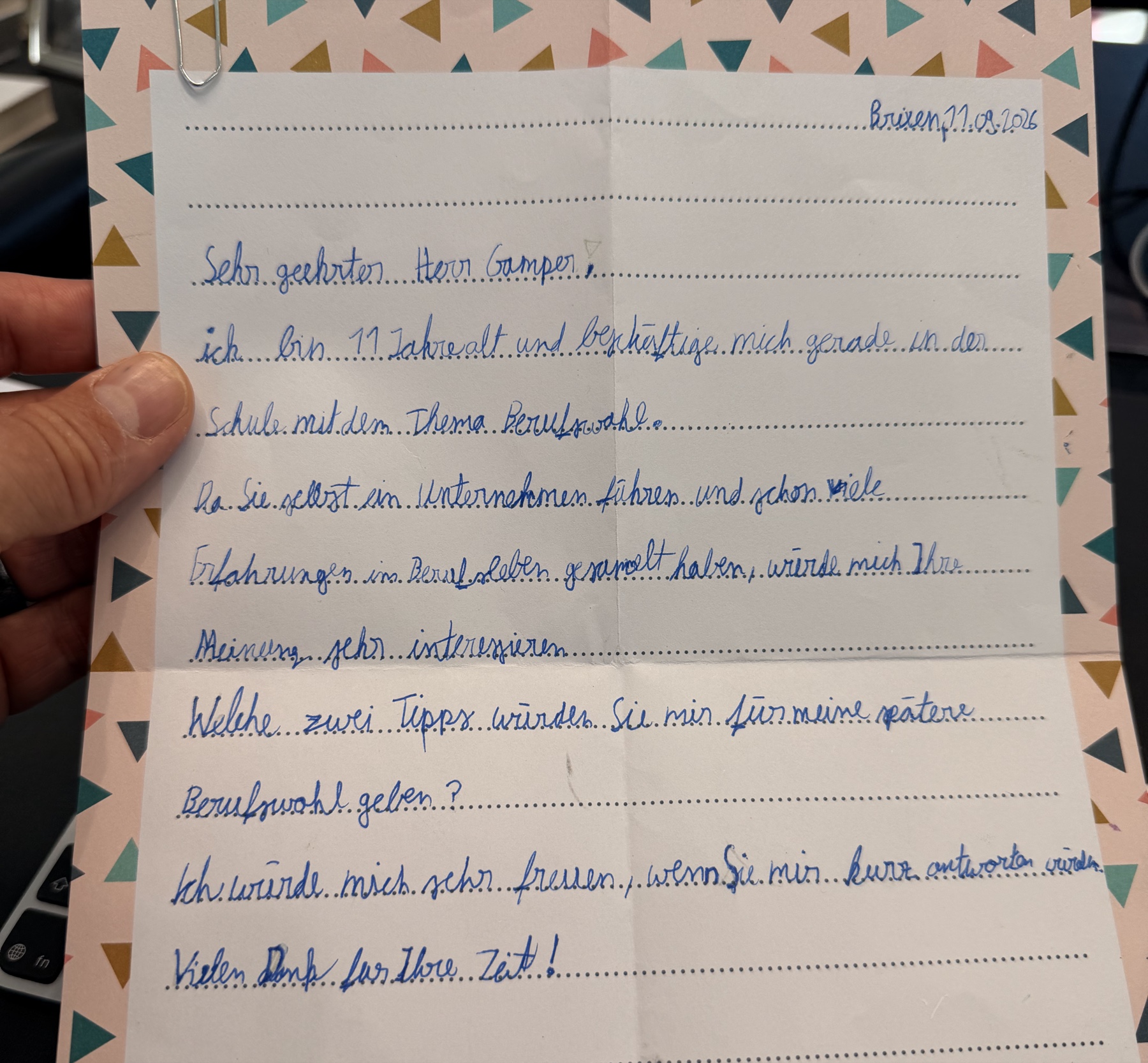 A letter in blue handwriting on dotted lines asking for two pieces of career advice. The sender’s name, school and class are outside the crop.